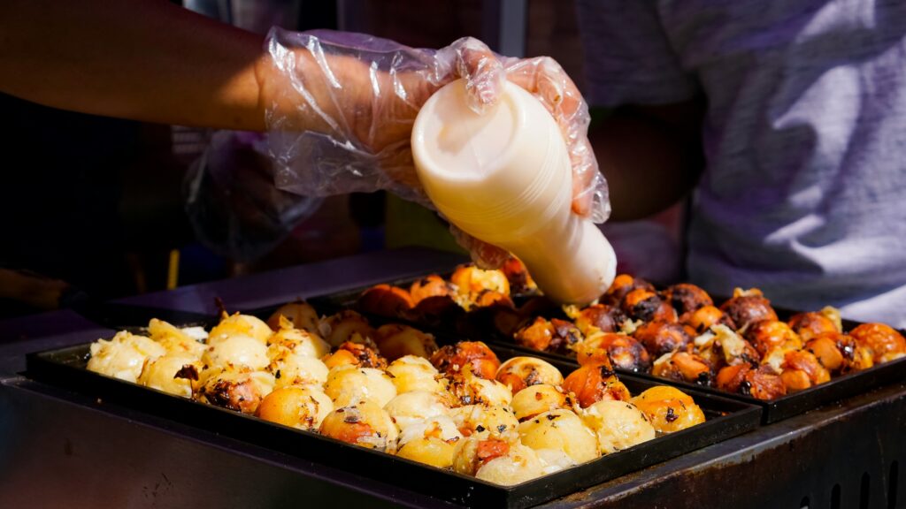 Takoyaki served on a tray in Osaka — Japan's most famous street food